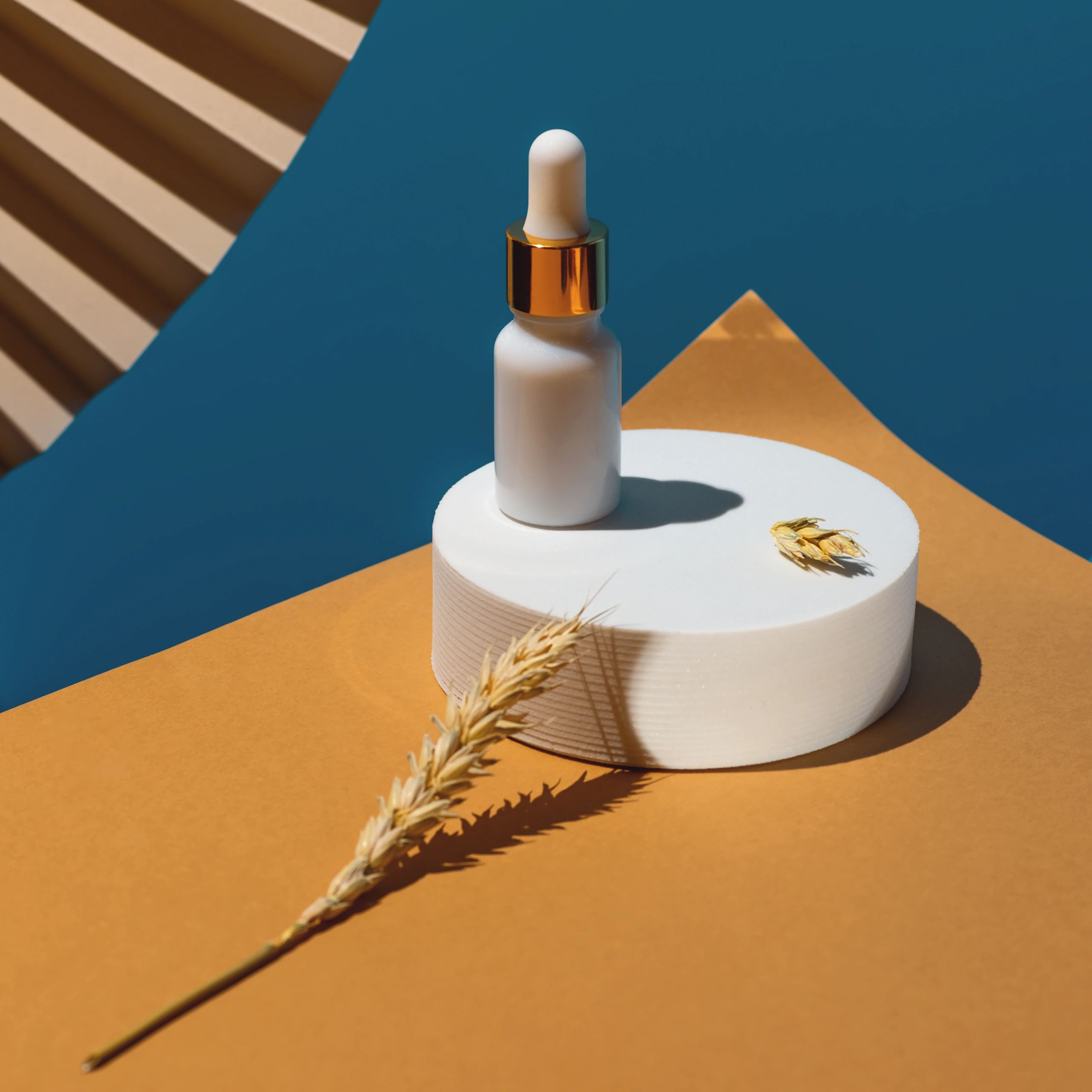 Golden facial serum and botanical skincare ingredients