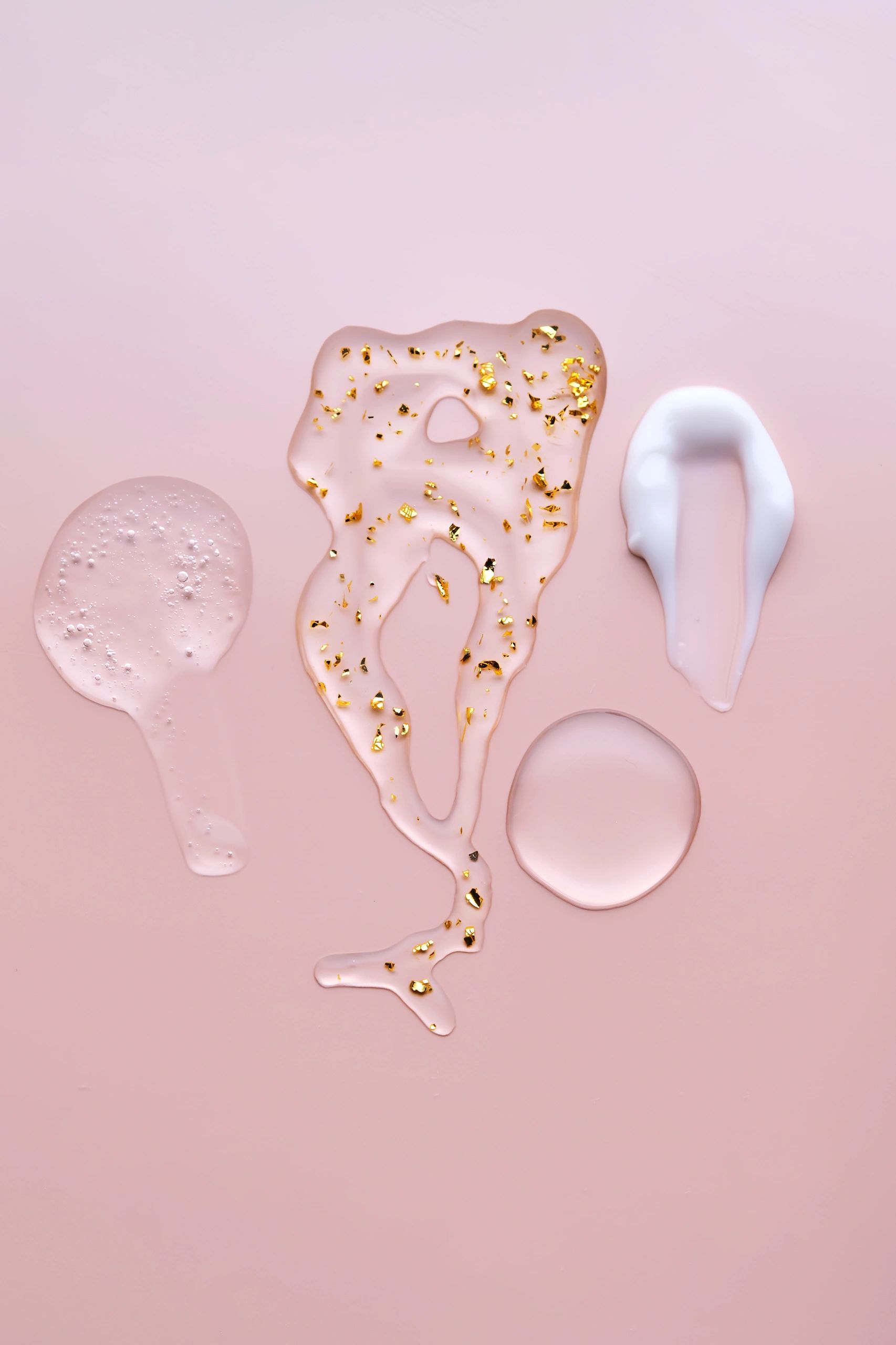 Serum and cream textures with gold accents