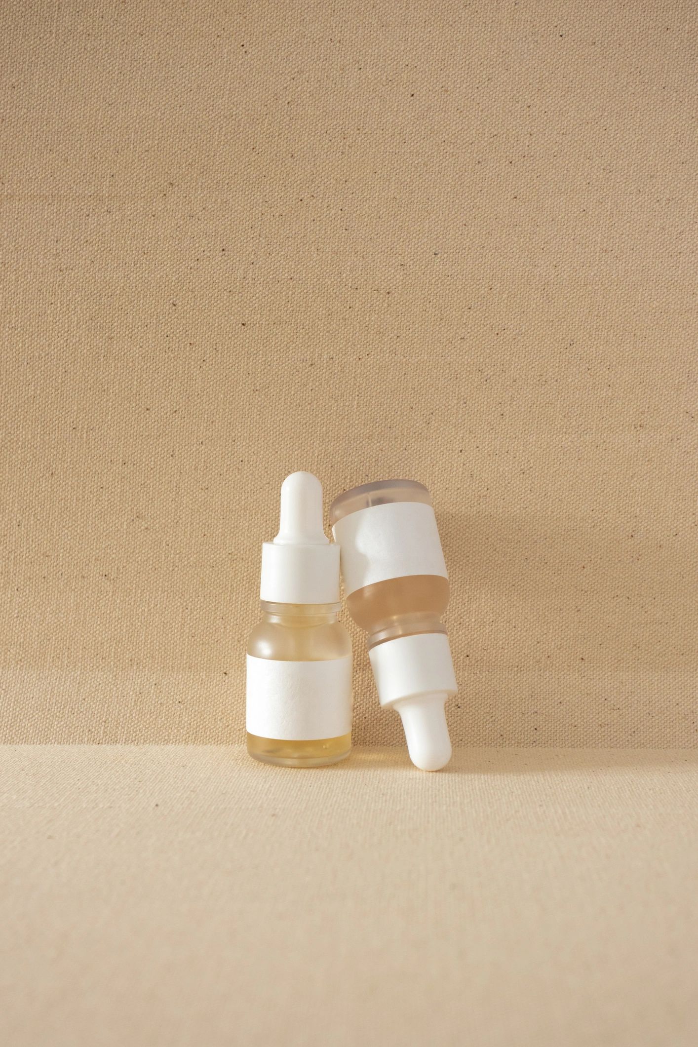 Minimal serum bottles on beige