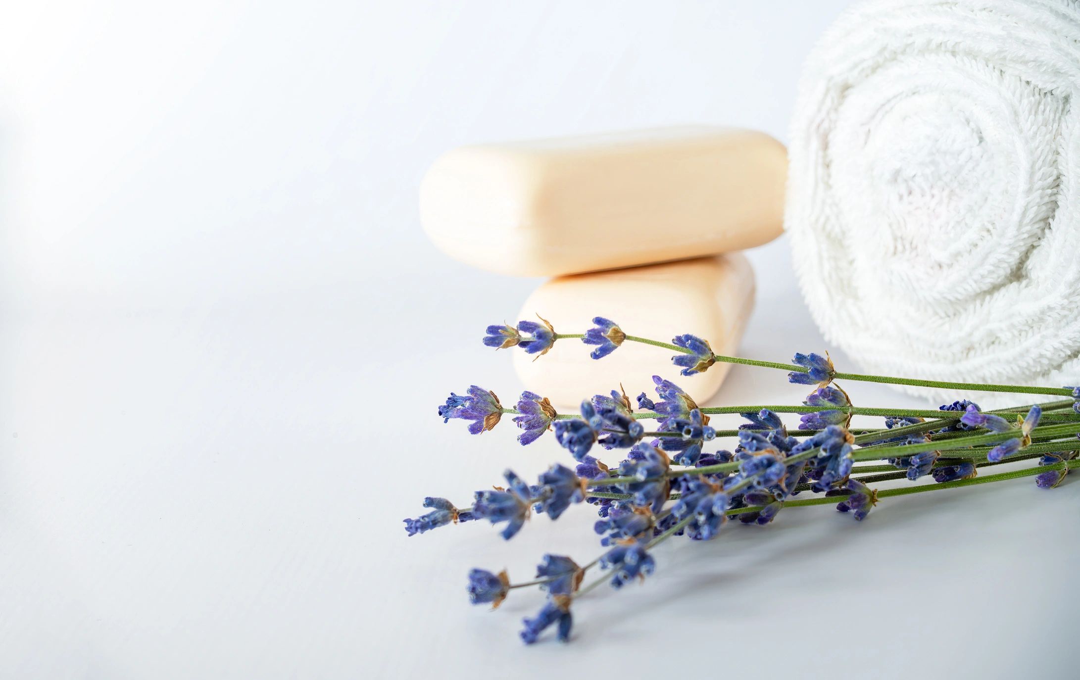 Calming spa arrangement with natural soap, towel and lavender